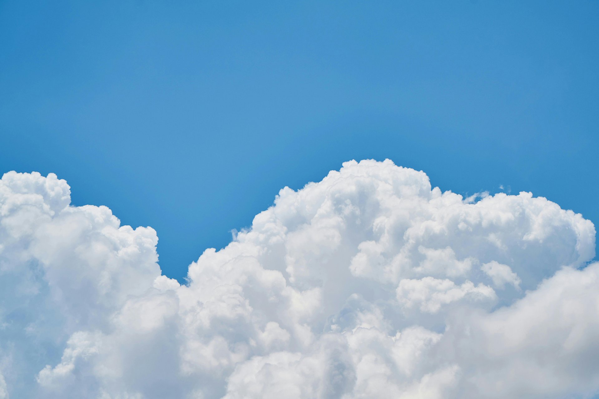 Blue sky with puffy clouds