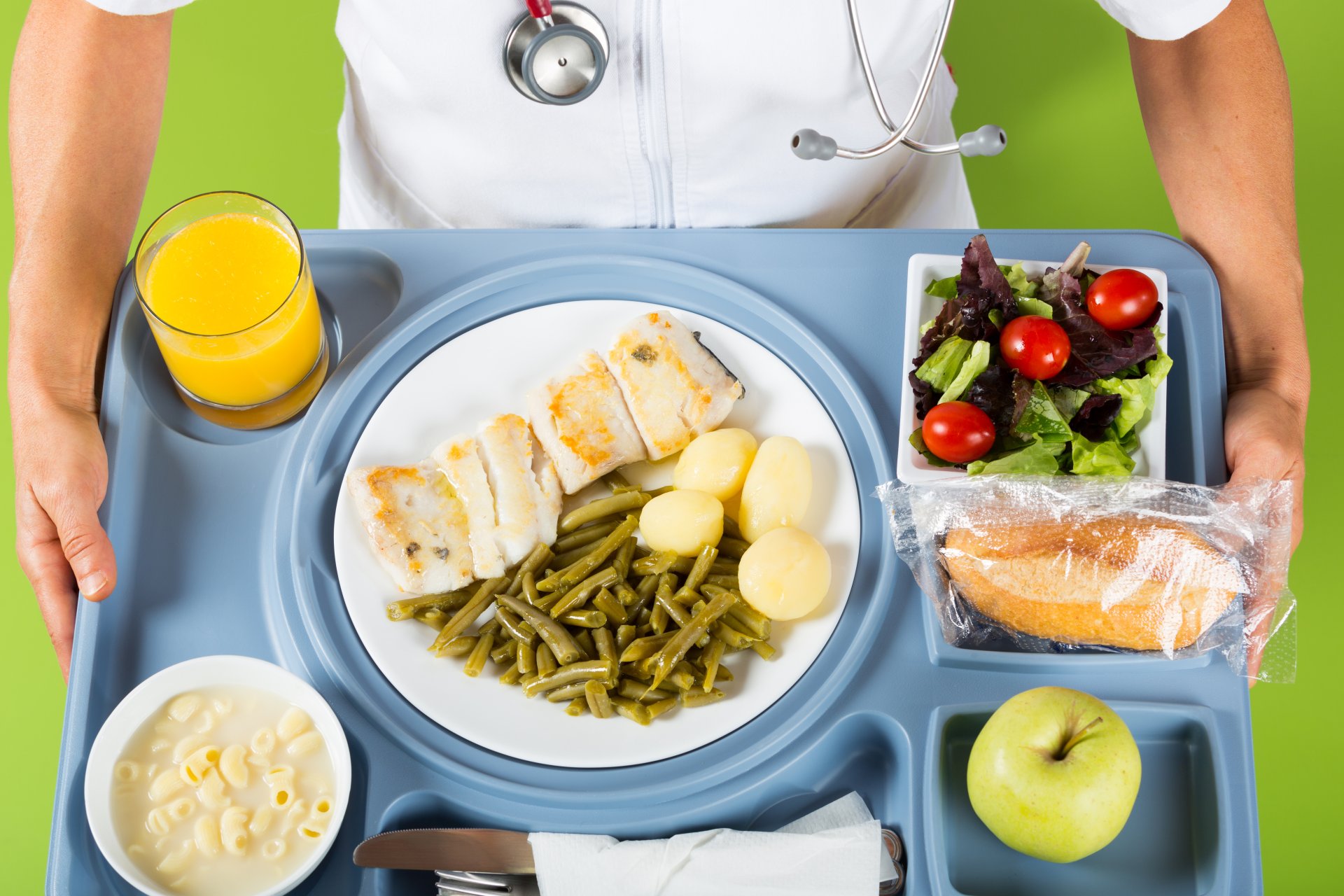 Doctor serves tray of healthy food